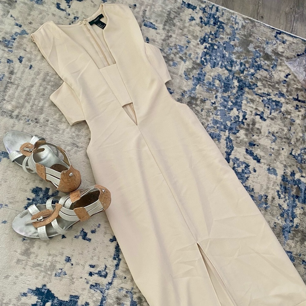 A midi-cream colored cut out party dress.